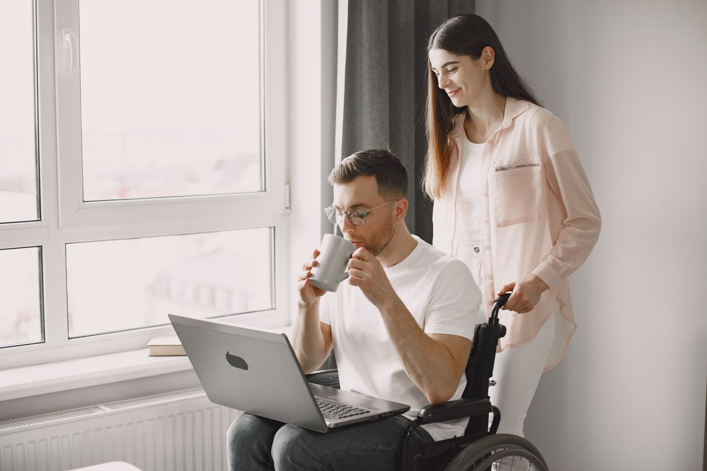 Support worker assisting an NDIS participant with daily living at home